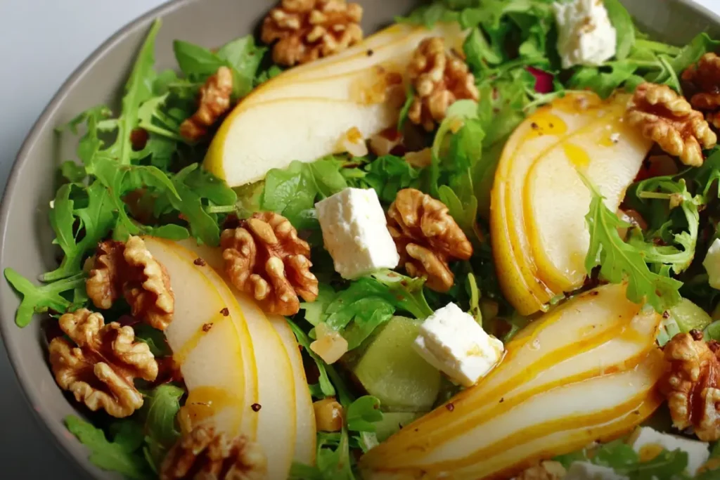 Pear Salad with Walnuts topped with goat cheese and balsamic